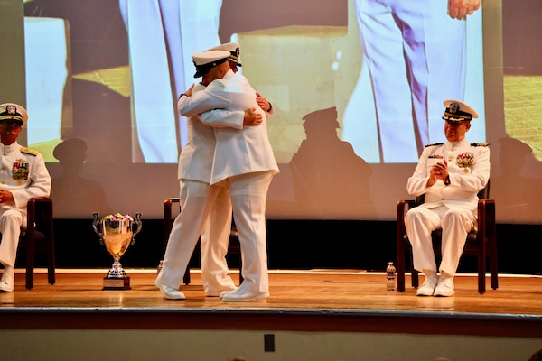 Navy Medicine Readiness and Training Command (NMRTC) Twentynine Palms marks a historic transition of leadership during a Change of Command and Retirement Ceremony held July 18, 2025, at the Marine Corps Air Ground Combat Center (MCAGCC) Theater. Capt. Janiese Cleckley relieved Capt. Daniel Clark as commanding officer of NMRTC Twentynine Palms and director of Naval Hospital Twentynine Palms. The event also included a retirement ceremony, as the command honored Clark’s 29 years of distinguished service in Navy Medicine (U.S. Navy photo by Christopher C. Jones, NHTP/NMRTC Twentynine Palms public affairs officer).