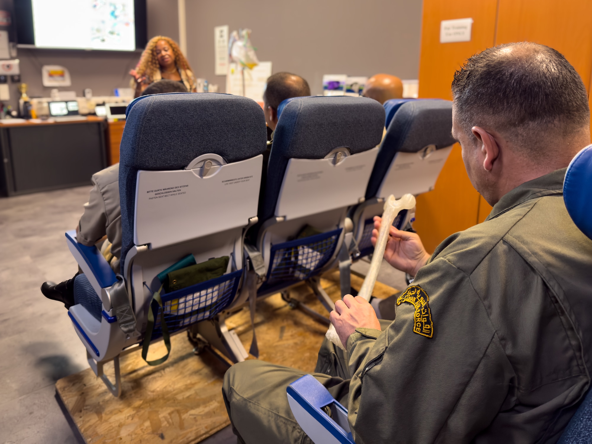 An Algerian military member examines a 3D printed bone as U.S. Air Force Brenda Robinson, 86th Aeromedical Evacuation Squadron healthcare simulation operations specialist, briefs training and simulation capabilities during an Algerian aeromedical evacuation familiarization visit at Ramstein Air Base, Germany, July 17, 2025. The visit, led by the U.S. Air Forces in Europe – Air Forces Africa Command Surgeon’s Office of Global Health Engagements and the 86th Aeromedical Evacuation Squadron, provided an opportunity for the U.S. and Algerian medical teams to exchange knowledge and best practices, strengthening respective capabilities.