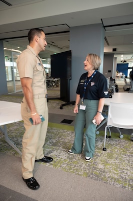 FORT LAUDERDALE, Fla. (July 12, 2025) Lt. Yhonnier Betancourt, attached to Reserve Talent Acquisition Group (RTAG) Southeast, speaks about Navy officer scholarship programs with Awilda Carozza, director of military affairs, Nova Southeastern University, during a "Top Doc" event. Navy Medicine and Navy Recruiting Command partnered with NSU to launch “Top Doc," a national initiative connecting local medical professionals, educators, and students while highlighting Navy Medicine’s capabilities and career opportunities. (U.S. Navy Photo by Mass Communication Specialist 1st Class Natalia Murillo)