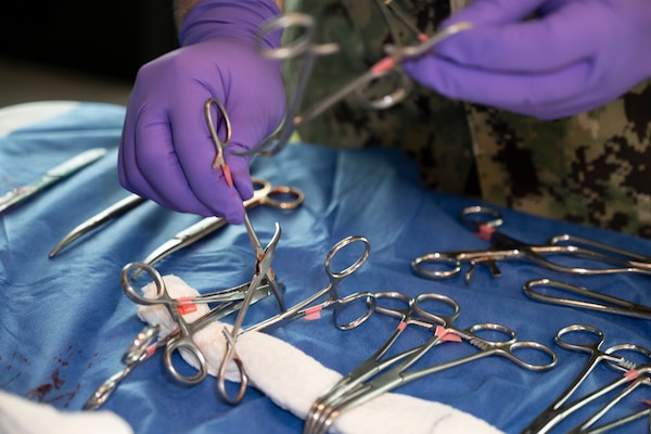 FORT LAUDERDALE, Fla. (July 12, 2025) Chief Hospital Corpsman Bryce Moheit, assigned to Navy Talent Acquisition Group Miami, sorts surgical clamps and scissors for use in a surgery simulation during the "Top Doc" event held at Nova Southeastern University's Fort Lauderdale campus. Navy Medicine and Navy Recruiting Command partnered with NSU to launch “Top Doc,” a national initiative connecting local medical professionals, educators, and students while highlighting Navy Medicine’s capabilities and career opportunities. (U.S. Navy Photo by Mass Communication Specialist 1st Class Natalia Murillo)