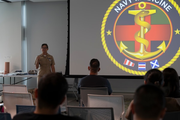 FORT LAUDERDALE, Fla. (July 12, 2025) Capt. Tara Mcginnis, medical officer programs officer, Navy Recruiting Command, addresses participants during the "Top Doc" event at Nova Southeastern University's Fort Lauderdale campus. Navy Medicine and Navy Recruiting Command partnered with NSU to launch “Top Doc”, a national initiative connecting local medical professionals, educators, and students while highlighting Navy Medicine’s capabilities and career opportunities. (U.S. Navy Photo by Mass Communication Specialist 1st Class Natalia Murillo)