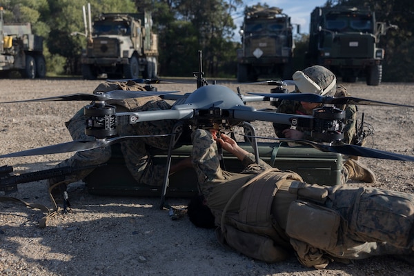 U.S. Marines Combat Logistics Company-Bravo, Combat Logistics Battalion 31, 31st Marine Expeditionary Unit, conduct a maintenance pre-flight check on a Tactical Resupply Unmanned Aircraft System during a resupply exercise at Sam Hill Airfield, Queensland, Australia, July 5, 2025. The TRUAS is a class 3 unmanned aerial vehicle that can deliver supplies to remote and inaccessible areas. The 31st MEU is operating aboard ships of the USS America Amphibious Ready Group in the 7th Fleet area of operations, the U.S. Navy’s largest forward-deployed numbered fleet, and routinely interacts and operates with allies and partners in preserving a free and open Indo-Pacific region. (U.S. Marine Corps photo by Lance Cpl. Skilah Sanchez)