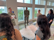 FORT LAUDERDALE, Fla. (July 12, 2025) Hospital Corpsman 1st Class Michael Dematti, assigned to Navy Talent Acquisition Group Miami, briefs on tactical evacuation care with participants of the "Top Doc" event held at Nova Southeastern University's Fort Lauderdale campus. Navy Medicine and Navy Recruiting Command partnered with NSU to launch the “Top Doc” event, a national initiative connecting local medical professionals, educators, and students while highlighting Navy Medicine’s capabilities and career opportunities. (U.S. Navy Photo by Mass Communication Specialist 1st Class Natalia Murillo)