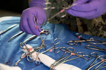 FORT LAUDERDALE, Fla. (July 12, 2025) Chief Hospital Corpsman Bryce Moheit, assigned to Navy Talent Acquisition Group Miami, sorts surgical clamps and scissors for use in a surgery simulation during the "Top Doc" event held at Nova Southeastern University's Fort Lauderdale campus. Navy Medicine and Navy Recruiting Command partnered with NSU to launch “Top Doc,” a national initiative connecting local medical professionals, educators, and students while highlighting Navy Medicine’s capabilities and career opportunities. (U.S. Navy Photo by Mass Communication Specialist 1st Class Natalia Murillo)