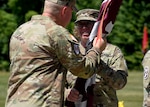 Col. Elizabeth H. Duque, the new commander of the U.S. Army Medical Department Activity (MEDDAC) – Fort Drum, receives the unit’s flag, or colors, from Brig. Gen. James D. Burk, commanding general of the U.S. Army Medical Readiness Command, East, during a change of command ceremony at Fort Drum, N.Y., July 18, 2025.