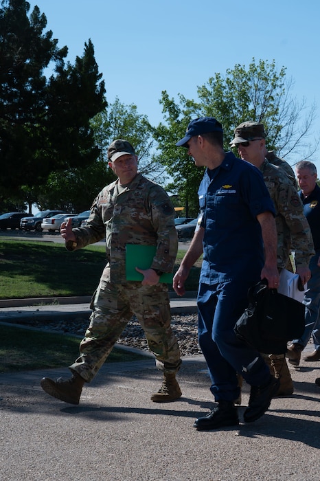 U.S. Air Force Col. Jason Gerber, 17th Training Group commander, briefs U.S. Coast Guard Rear Adm. Greg Rothrock, U.S. Cyber Command J7 Director of Force Development, during a walking tour to the 316th Training Squadron at Goodfellow Air Force Base, Texas, May 20, 2025. The walking tour showcased the cryptologic training campus and classrooms while providing detailed information on the training capabilities of the 17th TRG. (U.S. Air Force photo by Airman 1st Class Brian Lummus)