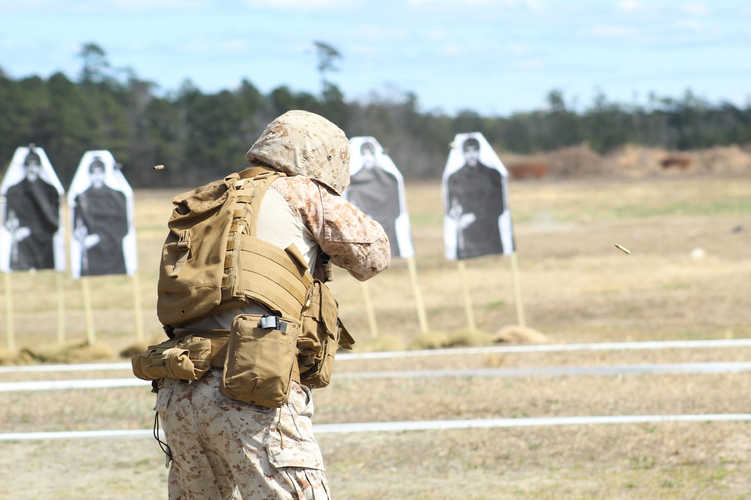 A Marine from 2d Intelligence Battalion executes a controlled pair during the live fire rifle portion of the battalion’s squad competition on 6 March 2025.