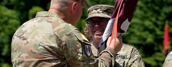 Col. Elizabeth H. Duque, the new commander of the U.S. Army Medical Department Activity (MEDDAC) – Fort Drum, receives the unit’s flag, or colors, from Brig. Gen. James D. Burk, commanding general of the U.S. Army Medical Readiness Command, East, during a change of command ceremony at Fort Drum, N.Y., July 18, 2025.