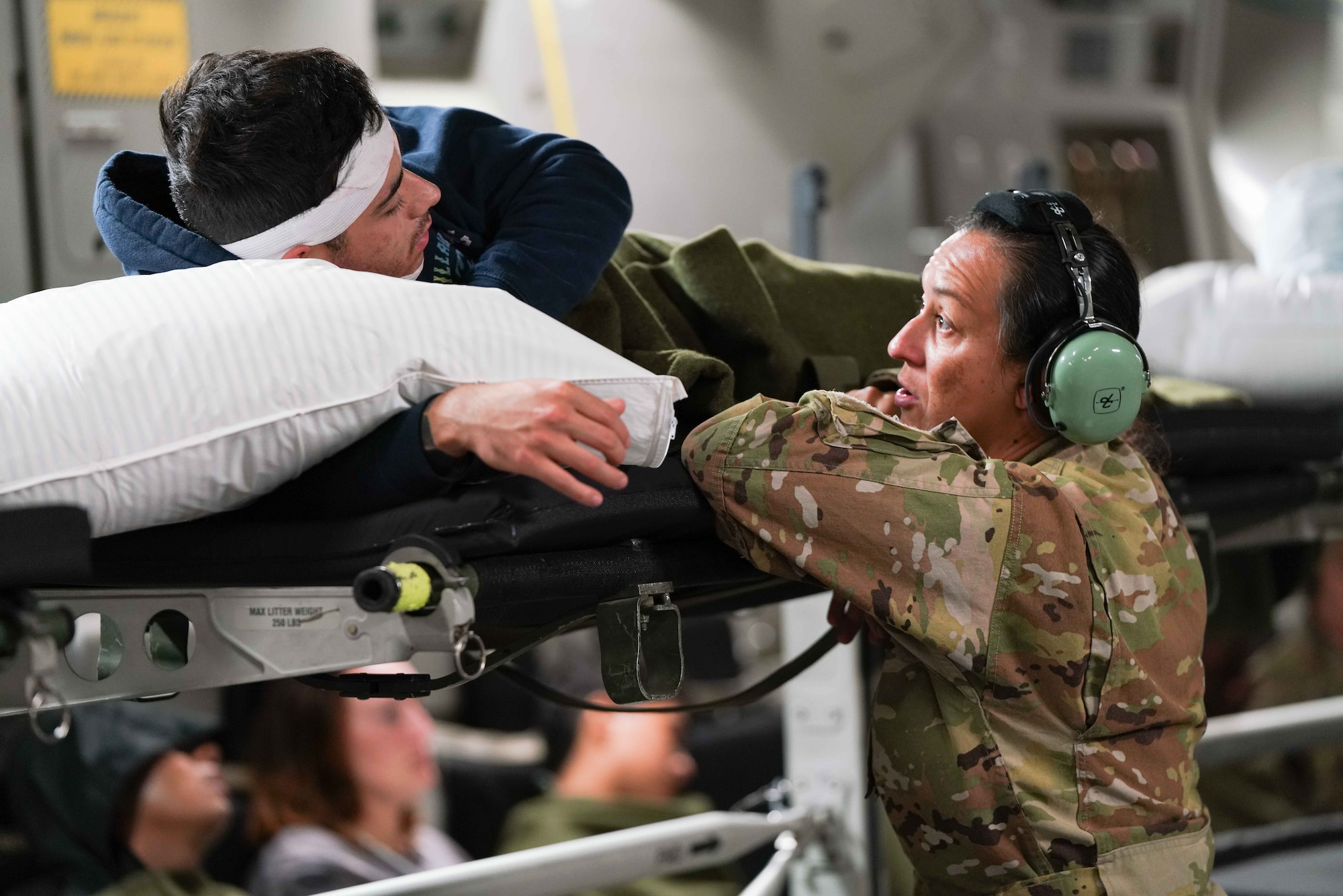 Image of an Airman treating a patient during an exercise.