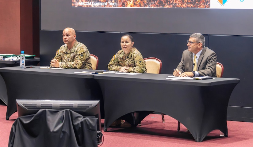 Maj. Gen. Lori Robinson, commanding general of the U.S. Army Aviation and Missile Command, speaks during the AMCOM Town Hall July 14 in the Bob Jones Auditorium on Redstone Arsenal, Alabama. She was joined by AMCOM Command Sgt. Maj. Christopher Doss and Don Nitti, deputy to the commanding general. Robinson addressed workforce concerns associated with the Army Transformation Initiative.
