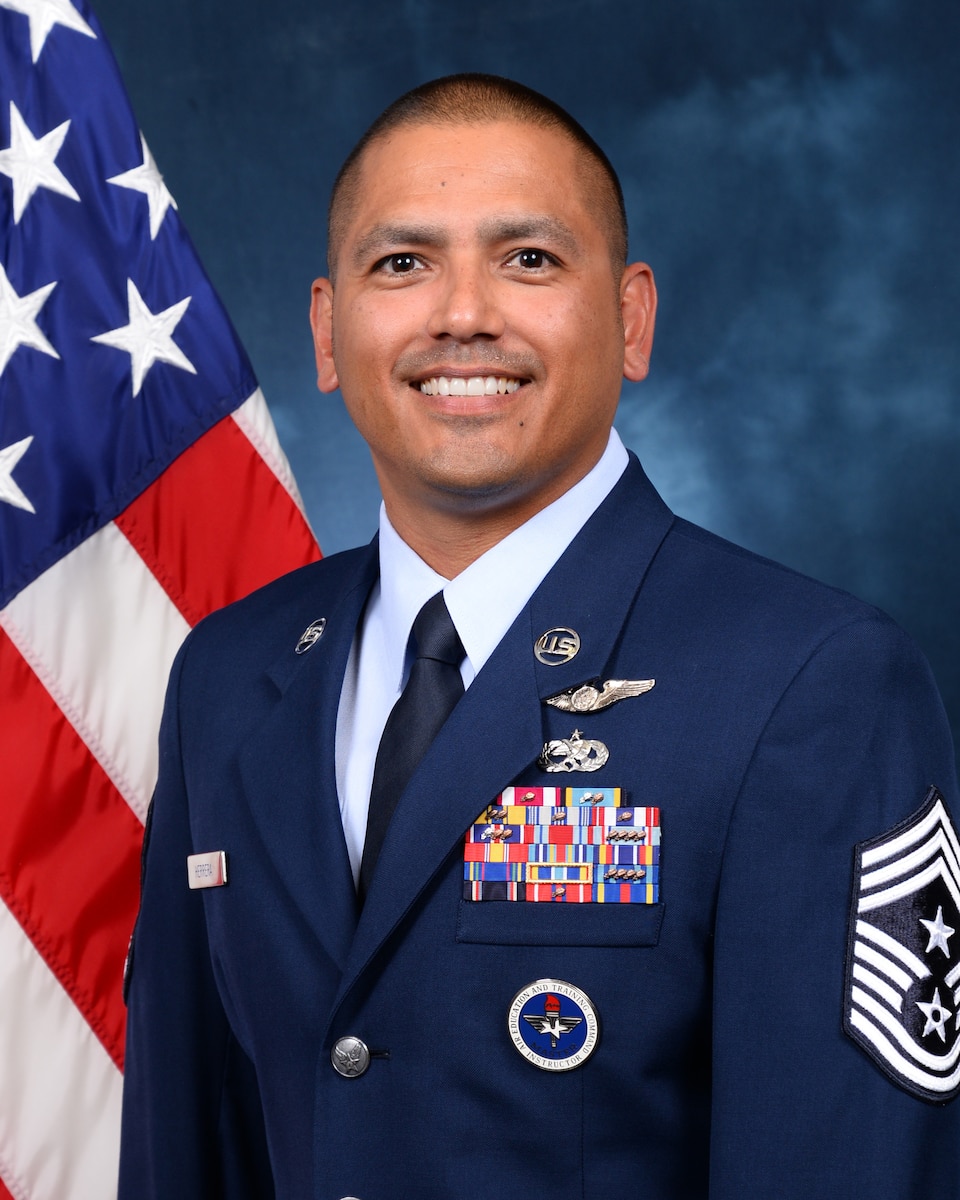 Chief Master Sgt. Edwardo Herrera, 10th Air Base Wing Command Chief, official photo.