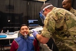 U.S. Air Force dental technician completes a dental X-ray for a local resident during Operation Healthy Tennessee, Rhea County Middle School, Evensville, Tenn., July 10, 2025. Operation Healthy Tennessee provides no-cost medical, dental, vision and veterinary services to the residents of Bledsoe and Rhea County, as well as the surrounding areas while satisfying training requirements for active-duty, reserve and Air National Guard service members and units.