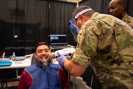 U.S. Air Force dental technician completes a dental X-ray for a local resident during Operation Healthy Tennessee, Rhea County Middle School, Evensville, Tenn., July 10, 2025.