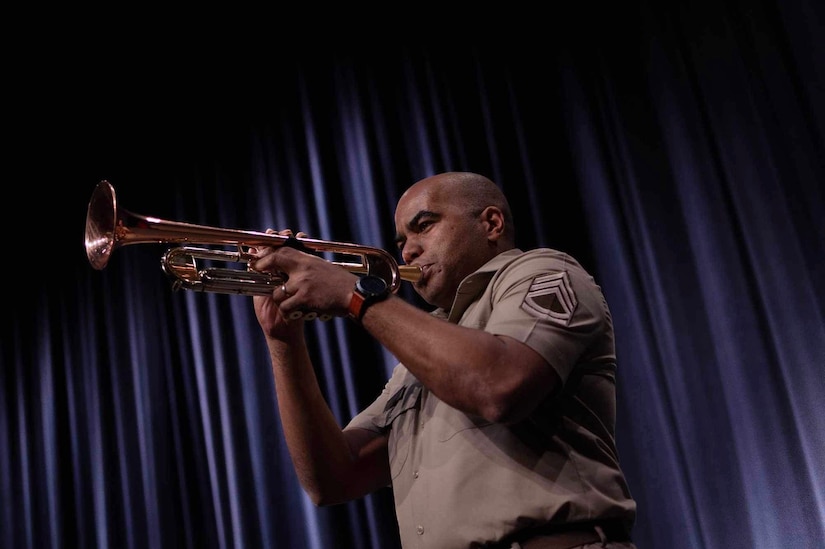 Sgt. 1st Class Williams playing the trumpet