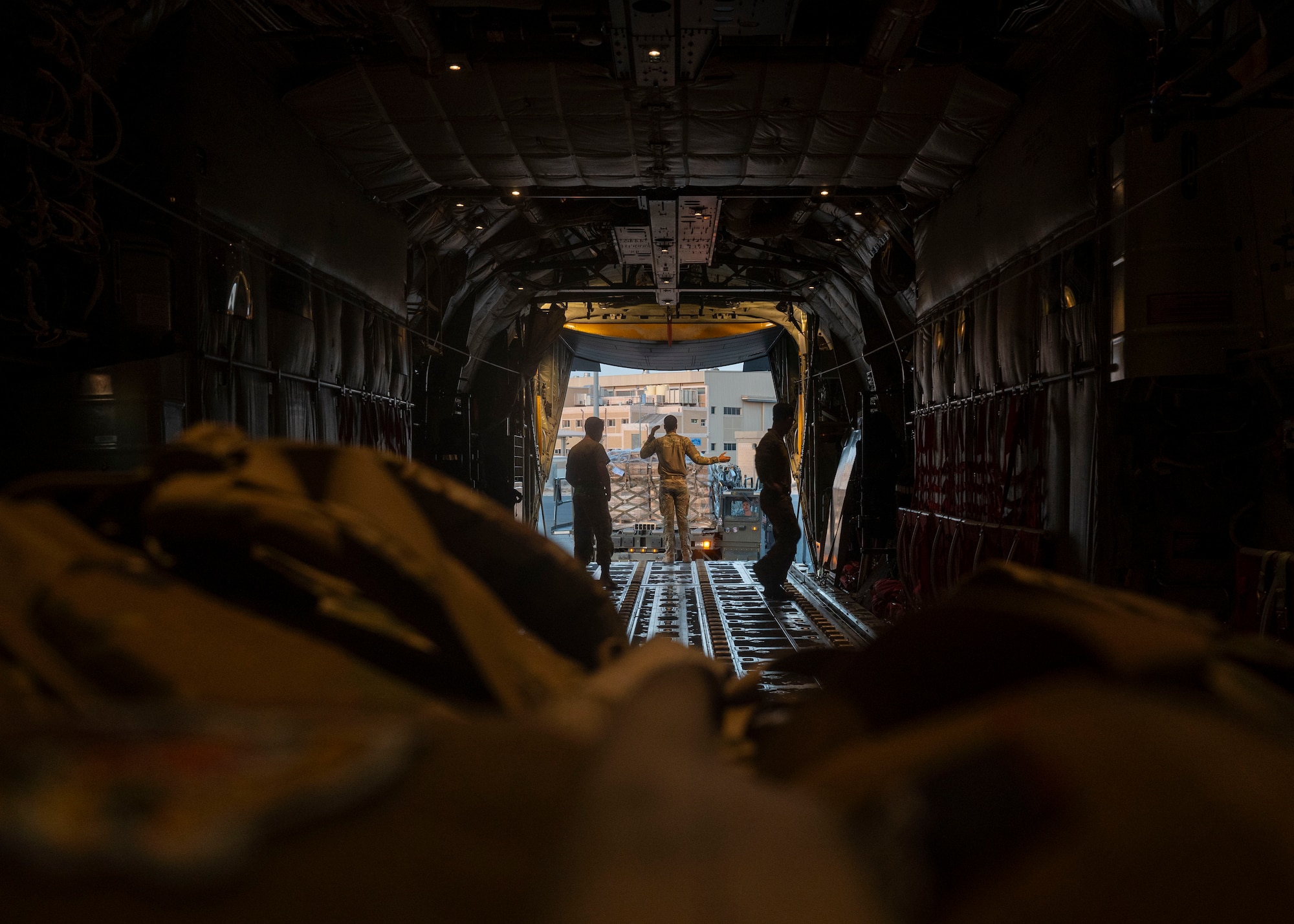 Airman performs pre-flight check on a C-130J