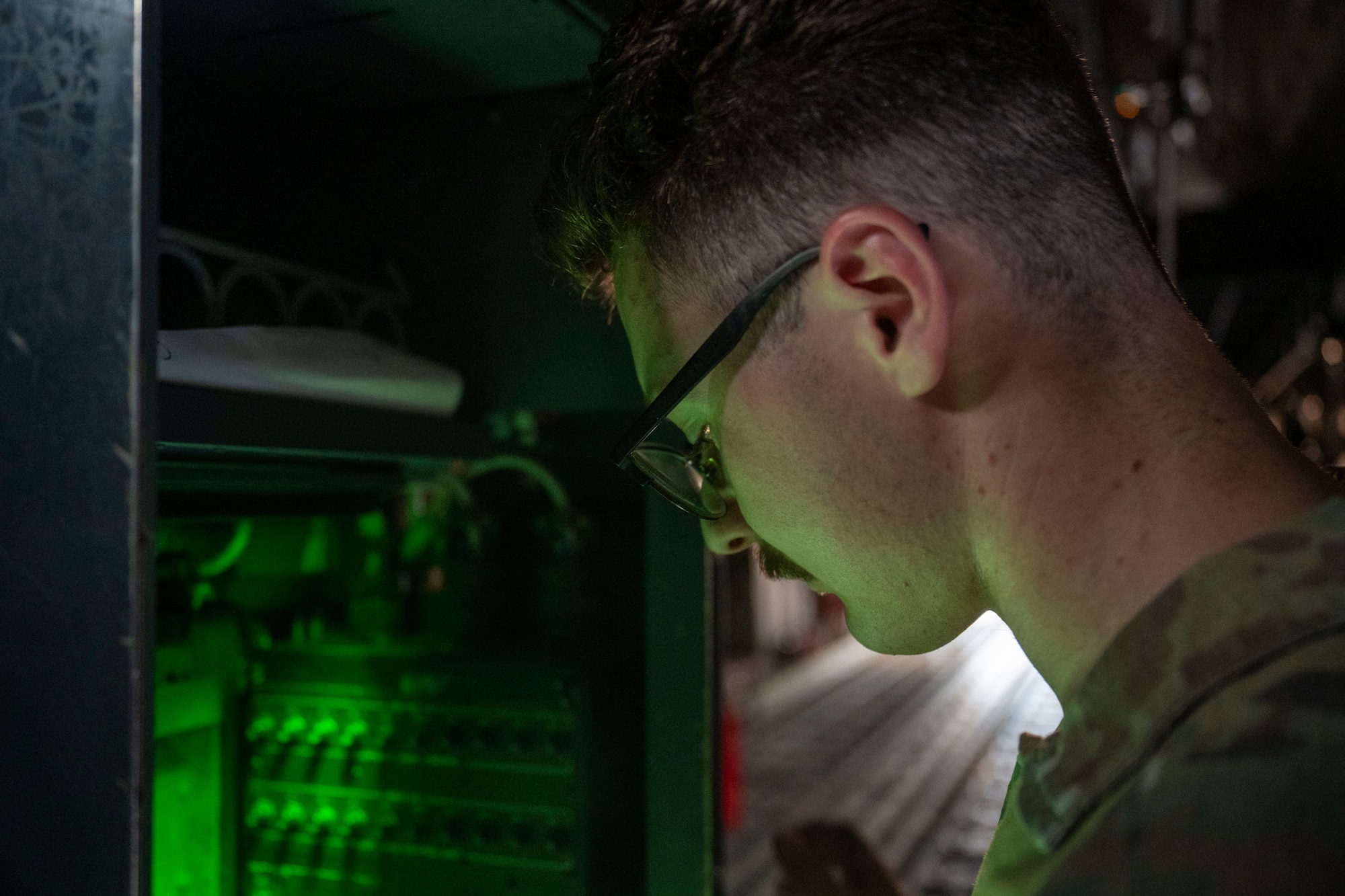 Airman performs pre-flight check on a C-130J