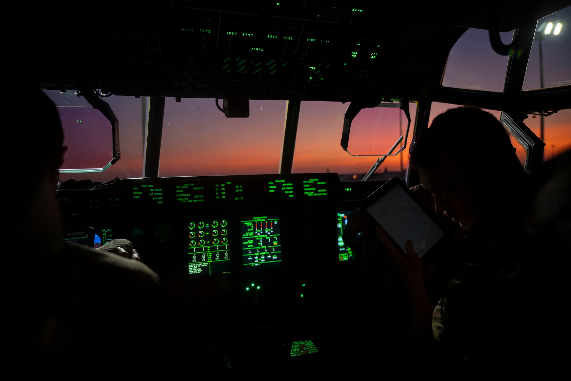 Airman performs pre-flight check on a C-130J