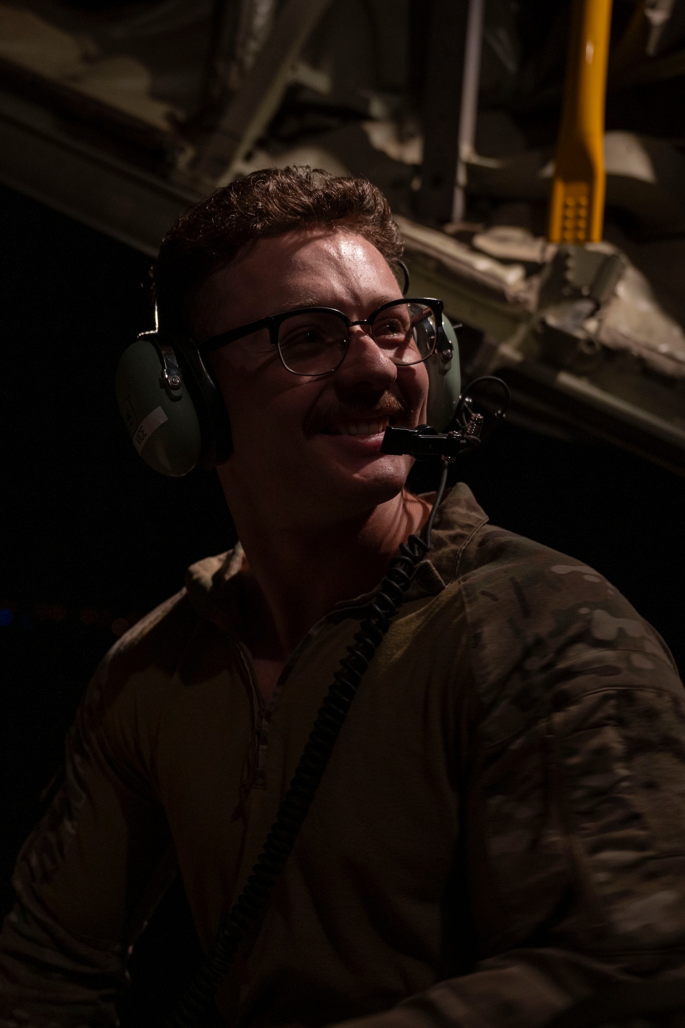 Airman performs pre-flight check on a C-130J