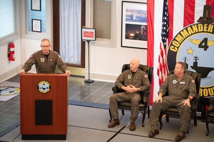 Rear Adm. Max McCoy speaks to staff during a change of command ceremony held at the command’s headquarters building of Carrier Strike Group 4 on Naval Station Norfolk, July 22.