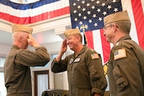 Rear Adm. Michael Spencer, commander, Carrier Strike Group 4, left, salutes Rear Adm. Jeffery Czerewko, special assistant to the director, Navy staff during a change of command ceremony held at Carrier Strike Group (CSG) 4 headquarters on Naval Station Norfolk, July 22.
