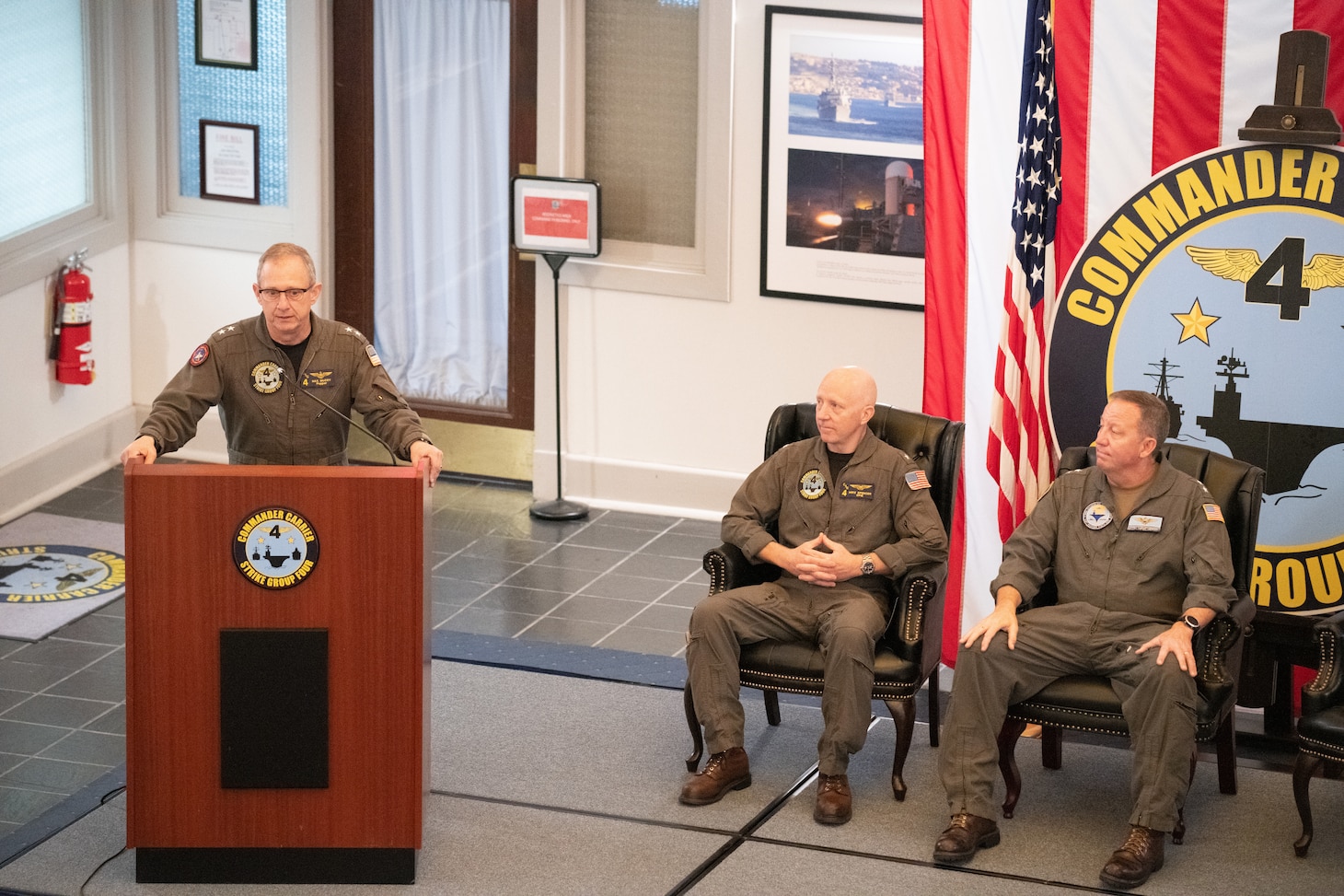 Rear Adm. Max McCoy speaks to staff during a change of command ceremony held at the command’s headquarters building of Carrier Strike Group 4 on Naval Station Norfolk, July 22.