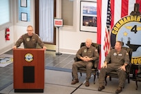 Rear Adm. Max McCoy speaks to staff during a change of command ceremony held at the command’s headquarters building of Carrier Strike Group 4 on Naval Station Norfolk, July 22.