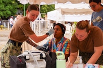 PUERTO PLATA, Dominican Republic (July 17, 2025) Hospital Corpsman 3rd Class Abby Marvin, assigned to the Mercy-class hospital ship USNS Comfort (T-AH 20), takes a Dominican patient’s temperature at a medical site in Puerto Plata, Dominican Republic during Continuing Promise 2025, July 17, 2025. Continuing Promise 2025 is the 16th iteration of the U.S. 4th Fleet/U.S. Naval Forces Southern Command-led mission since 2007, which aims to foster goodwill, strengthen existing partnerships with partner nations, and form new partnerships between host nations, non-federal entities, and international organizations. (U.S. Army photo by Cpl. William Hunter)