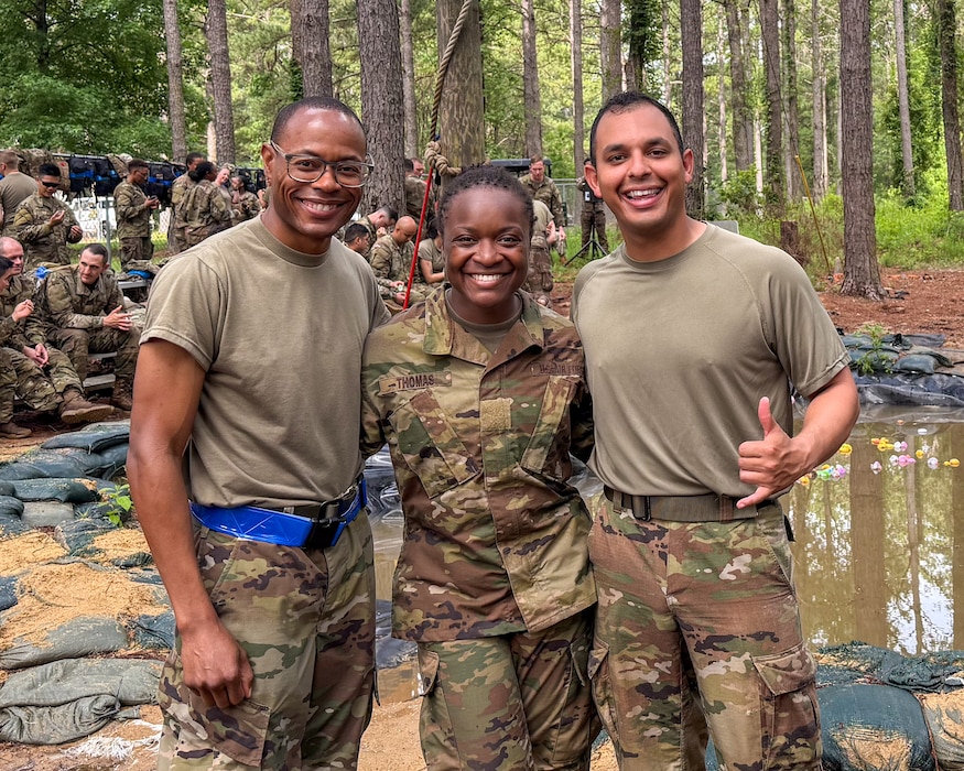 From left, 1st Lt. Marlon Reid, 2nd Lt. Faith Thomas, and 2nd Lt. Sergio Correa pose for a photo after completing an obstacle course during Operation Pacific Sword at Maxwell Air Force Base, Alabama, June 13, 2025. The course marked the final event of the field training portion of Officer Training School. (Courtesy photo)
