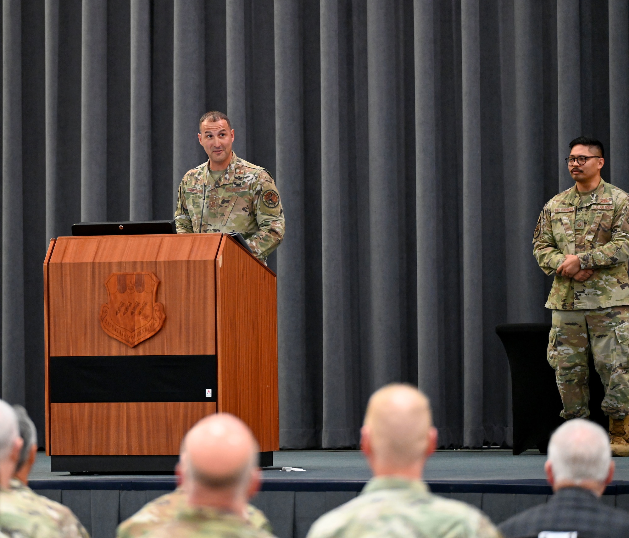 Chief Master Sgt. Brandon Wolfgang address the audience