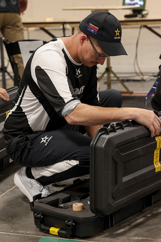 U.S. Army Staff Sgt. Coty Tuck puts away his air rifle at the precision air event during the 2025 Department of Defense Warrior Games at Colorado Springs, Colorado, July 20, 2025.