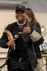U.S. Army Capt. Channda Mitchell gets help putting on her shooting jacket for the precision air event (air rifle) during the 2025 Department of Defense Warrior Games at Colorado Springs, Colorado, July 20, 2025.