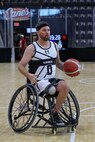U.S. Army Retired Staff Sgt. John Michael Britton practices layups before a wheelchair basketball game during the 2025 Department of Defense Warrior Games at Colorado Springs, Colorado, July 20, 2025.