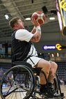 U.S. Army Staff Sgt. Tyler Pollard shoots a three-pointer during a wheelchair basketball game at the 2025 Department of Defense Warrior Games at Colorado Springs, Colorado, July 20, 2025.