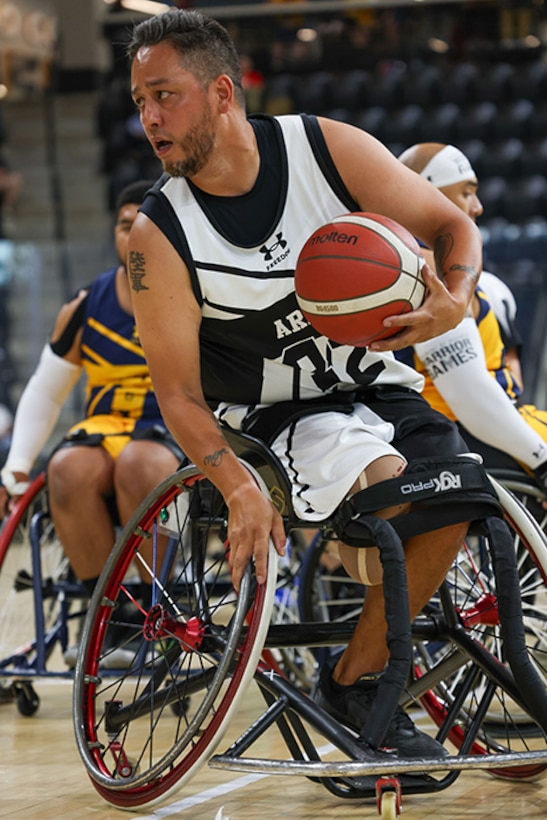 U.S. Army Retired Spc. Anthony Farve turns up court during a wheelchair basketball game against Team Navy at the 2025 Department of Defense Warrior Games at Colorado Springs, Colorado, July 20, 2025.