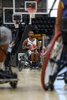 U.S. Army Staff Sgt. Allaijah Churchwell looks for an opening to pass the ball during a wheelchair basketball game at the 2025 Department of Defense Warrior Games at Colorado Springs, Colorado, July 20, 2025.