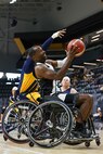U.S. Army Staff Sgt. Derrick Thompson attempts a layup during a wheelchair basketball game against Team Navy at the 2025 Department of Defense Warrior Games at Colorado Springs, Colorado, July 20, 2025.