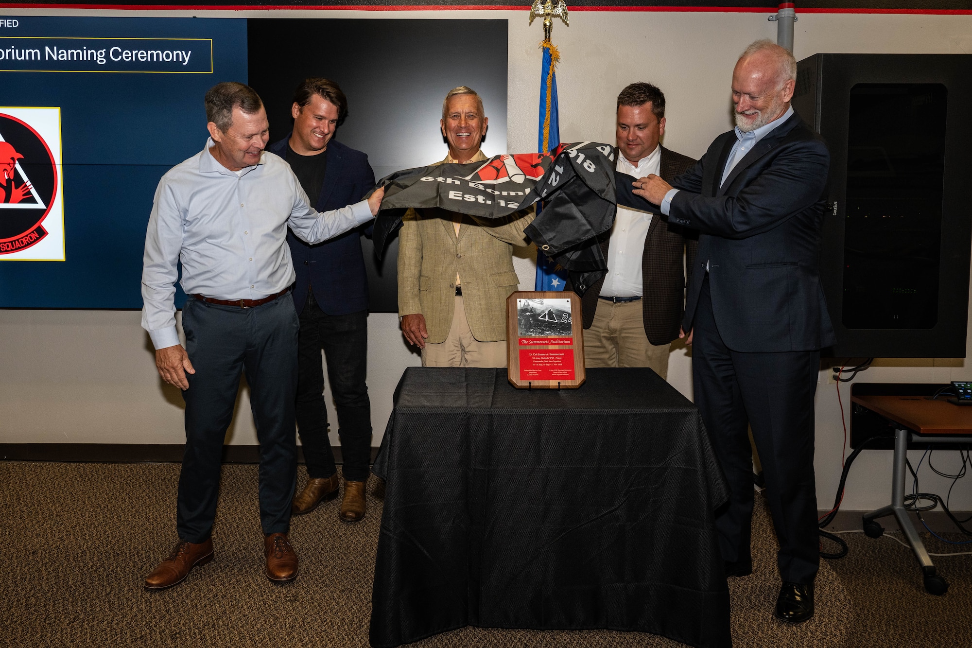 Members of Lt. Col. James Summersett’s family reveal a plaque