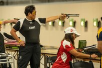 U.S. Army Chief Warrant Officer 4 Joann Tsuhako fires an air pistol during the precision air event at the 2025 Department of Defense Warrior Games in Colorado Springs, Colorado, July 21, 2025.
