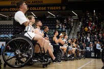 Team Army athletes hold their hands over their hearts during the national anthem before the wheelchair basketball gold medal game at the 2025 Department of Defense Warrior Games in Colorado Springs Colorado, July 20, 2025.