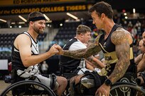 U.S. Army Retired Staff Sgt. John Michael Britton shakes hands with U.S. Army Master Sgt. Mike Haley from Team SOCOM before the wheelchair basketball gold medal game at the 2025 Department of Defense Warrior Games in Colorado Springs Colorado, July 20, 2025.