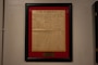 A copy of The New York Times from 1918 hangs from the wall