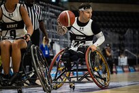 U.S. Army Retired Spc. JP Lane takes the basketball up court during the wheelchair basketball gold medal game against Team SOCOM at the 2025 Department of Defense Warrior Games in Colorado Springs Colorado, July 20, 2025.