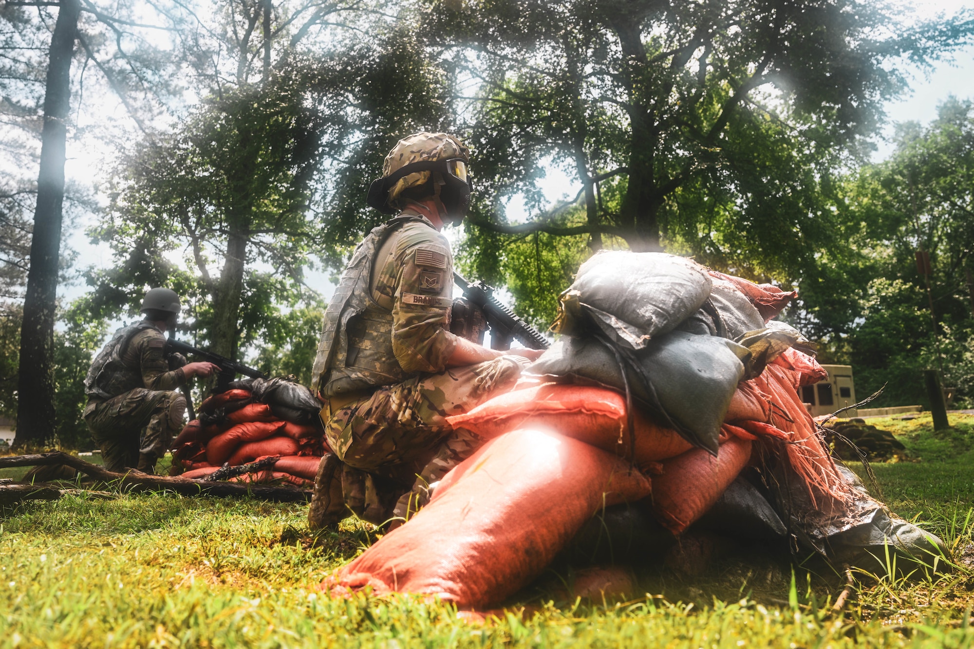 Men in uniform man a defensive position.