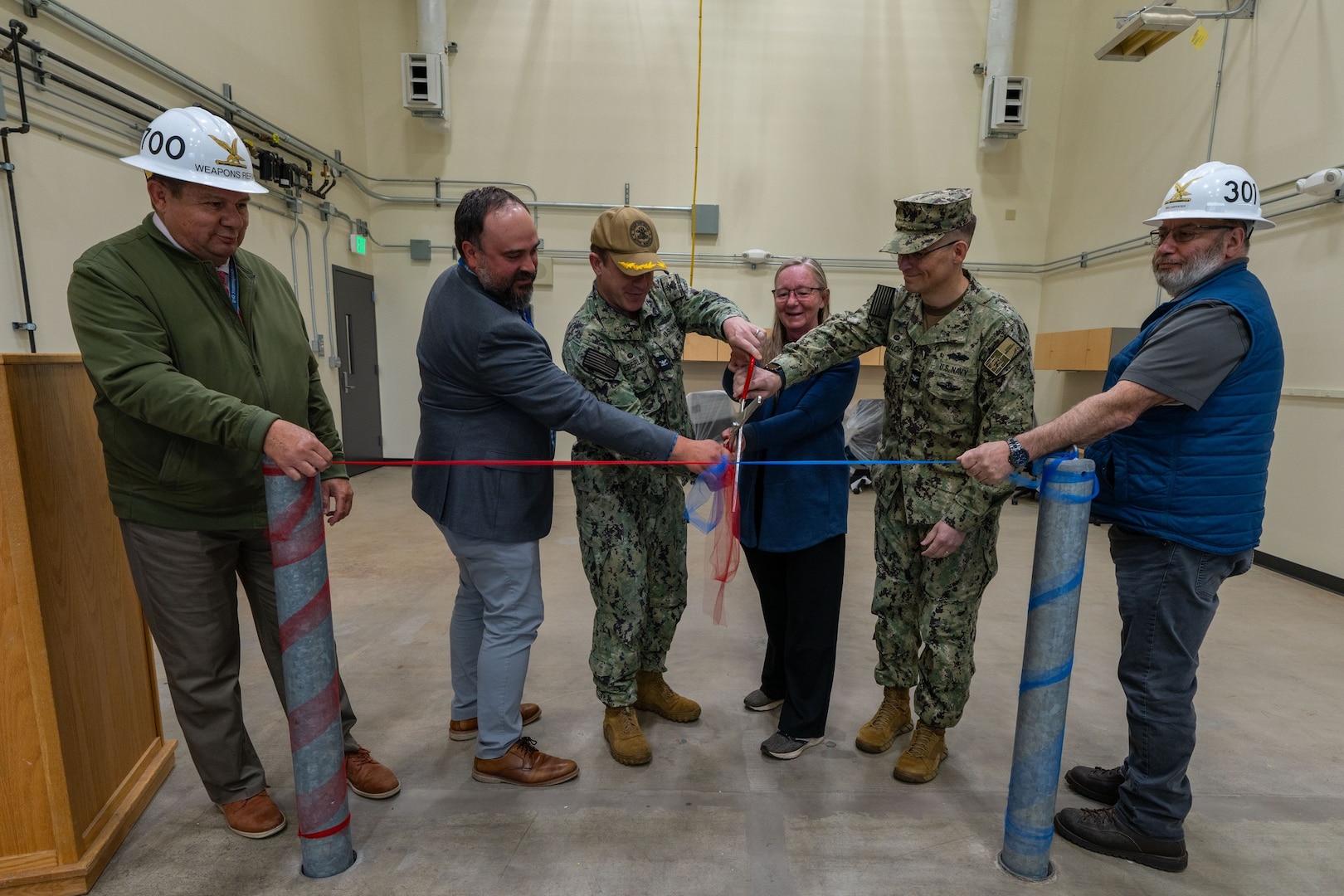TRFB leadership conduct a ribbon cutting during a ribbon cutting ceremony at TRFB.