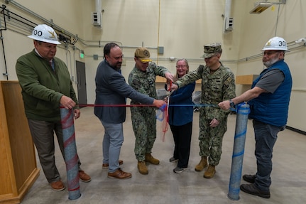 TRFB leadership conduct a ribbon cutting during a ribbon cutting ceremony at TRFB.
