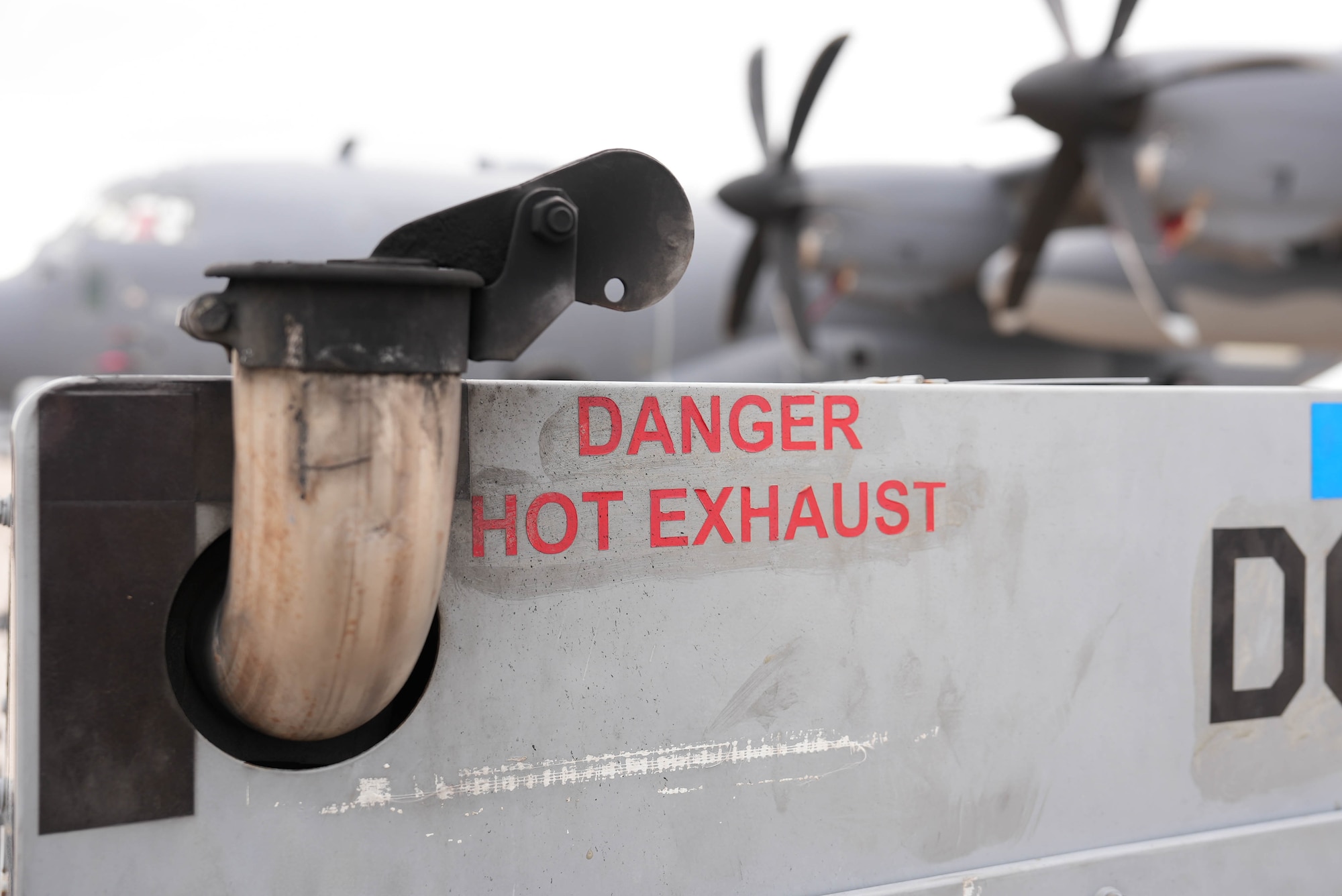An aerospace ground equipment asset supplies power to an AC-130 Ghostrider at Cannon Air Force Base, New Mexico, July 1, 2025. The AGE flight is responsible for the inspection and maintenance of a more than 900-asset equipment account, encompassing all the hardware that enables aircraft maintenance on the flightline. (U.S. Air Force photo by Staff Sgt. Kevin Williams)
