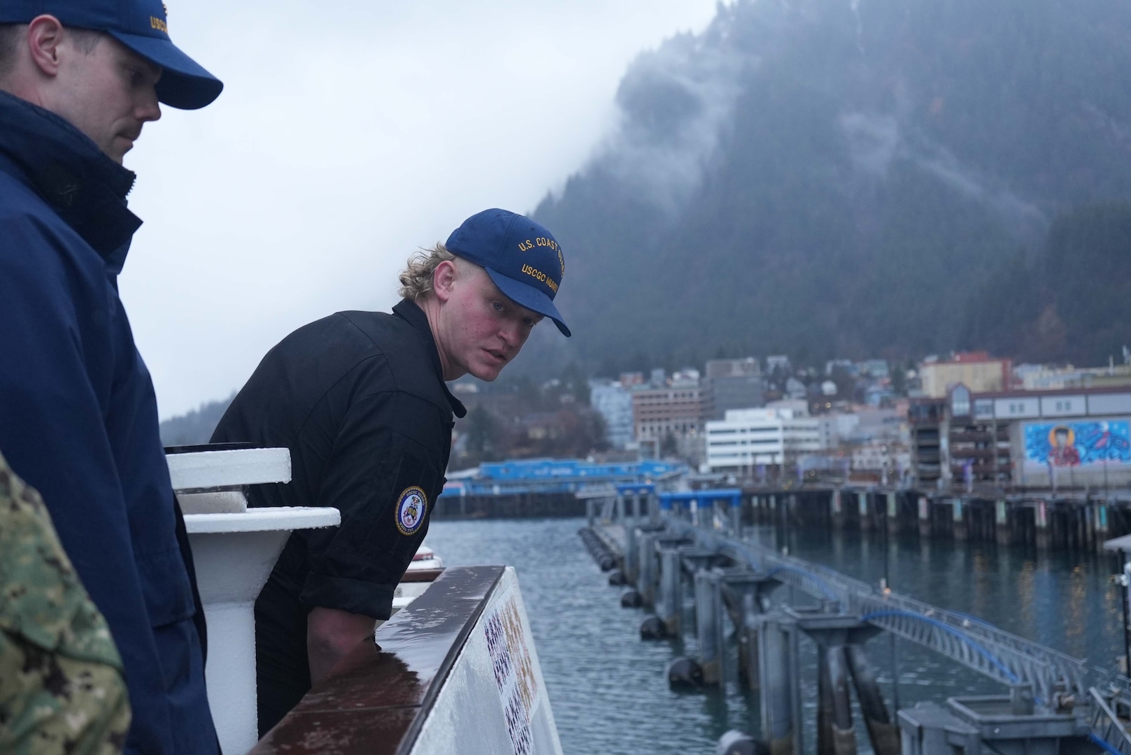 Sub-Lieutenant Adam Beaupré, a member of the Royal Canadian Navy (RCN), aids in the careful maneuvering of U.S. Coast Guard Cutter Munro (WMSL 755) alongside a pier in Juneau, Alaska May 23, 2025. Munro hosted two RCN officers to expand opportunities for professional naval exchanges with U.S. allies and enhance credible deterrence alongside key partners in Coast Guard District Arctic. (U.S. Coast Guard photo by Lt. j.g. Samika Lewis)