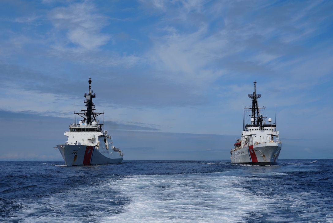 U.S. Coast Guard Cutter Munro (WMSL 755) and the U.S. Coast Guard Cutter Alex Haley (WMEC 38) steam alongside while patrolling the Gulf of Alaska July 5, 2025. Alex Haley relieved Munro as the Bering Sea cutter in early July. (U.S.  Coast Guard photo by Lt. j.g. Samika Lewis)
