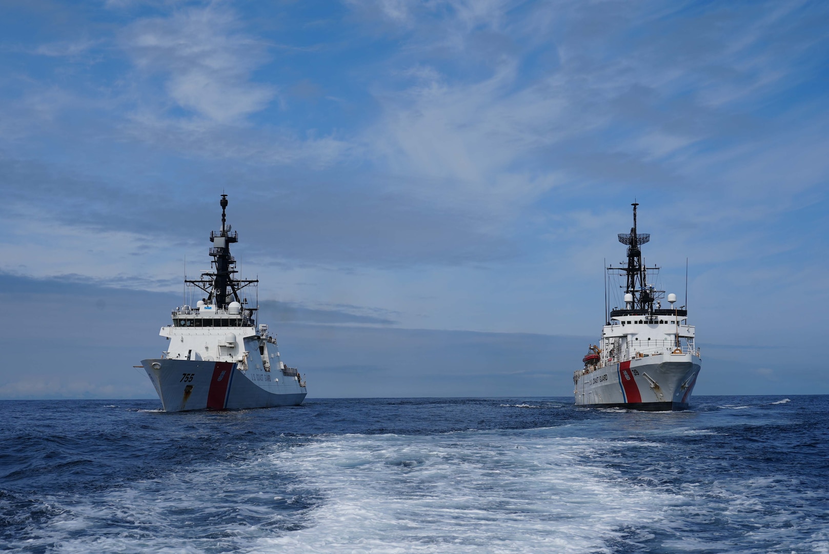 U.S. Coast Guard Cutter Munro (WMSL 755) and the U.S. Coast Guard Cutter Alex Haley (WMEC 38) steam alongside while patrolling the Gulf of Alaska July 5, 2025. Alex Haley relieved Munro as the Bering Sea cutter in early July. (U.S.  Coast Guard photo by Lt. j.g. Samika Lewis)