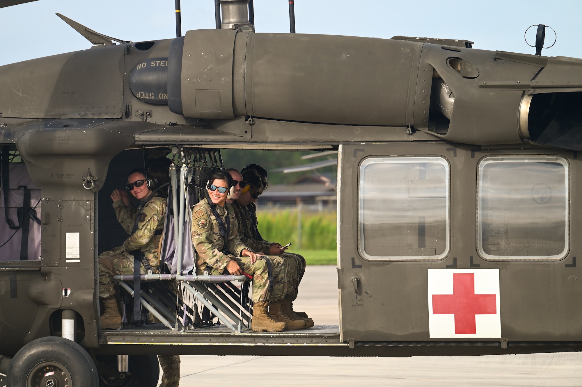 U.S. Air Force personnel from the 74th and 26th Aerial Port Squadron prepare for takeoff aboard a Texas Army National Guard UH-60 Black Hawk helicopter during Operation Dustoff Vigilance ’25, at Martindale Army Airfield, Texas, July 16, 2025.